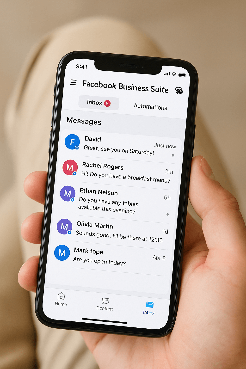 Mobile device showing Facebook Business Suite app with message notifications and response management interface